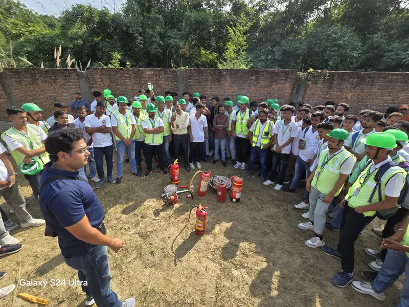 Students practising with extinguishers